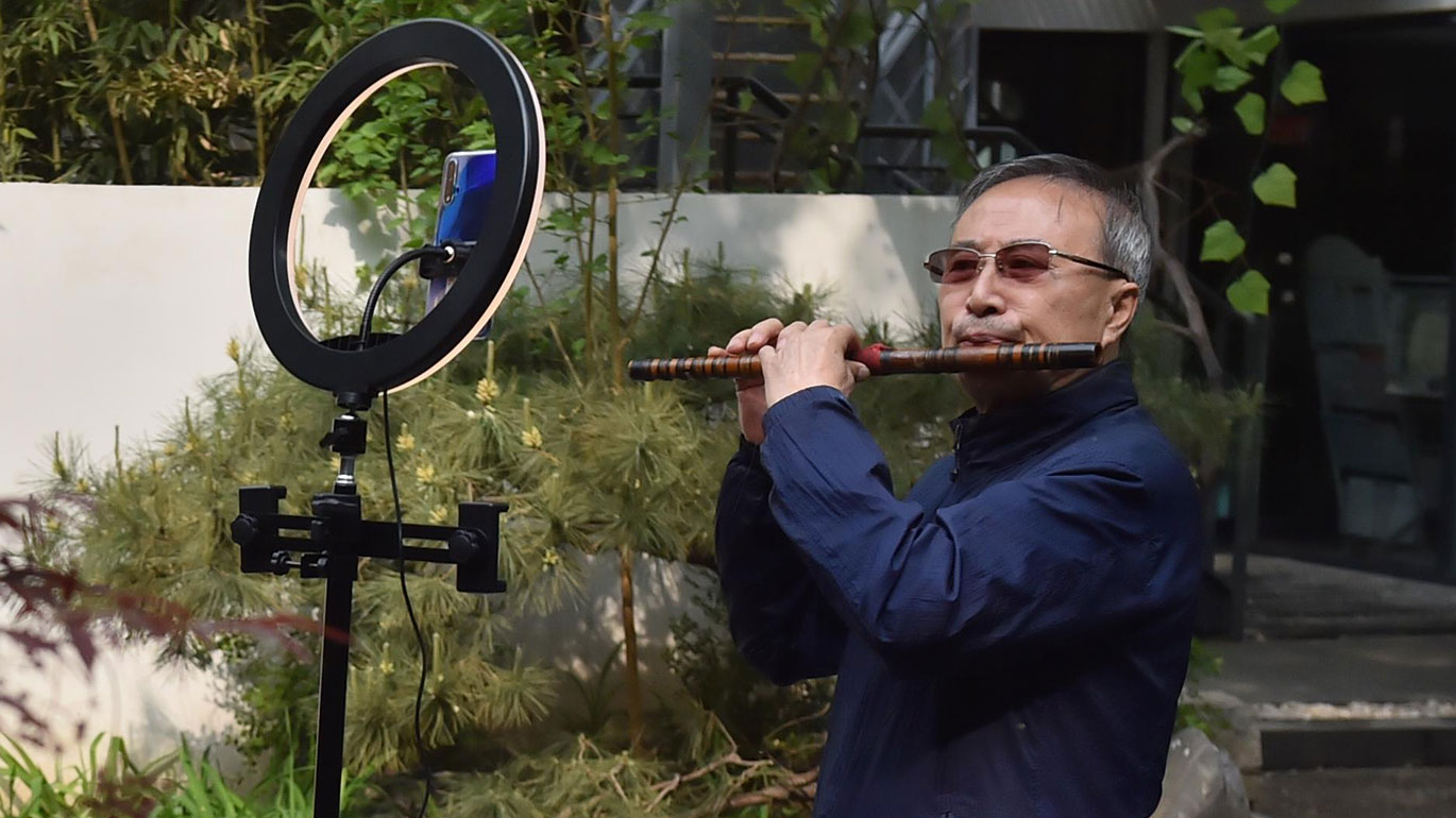 Among those showcasing their talents is flute player Li Julong, 69 (Xinhua/Peng Ziyang)
