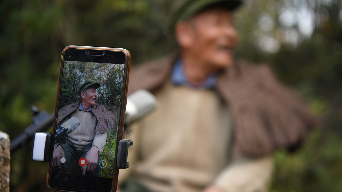 Peng Guofei, 75 – aka ‘Grandpa Fei’ – is one of China’s most well-known senior content creators (Xinhua/Xue Yuge)